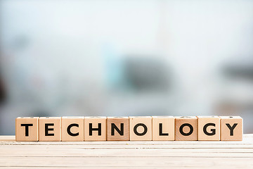 Image showing Technology sign on a wooden desk
