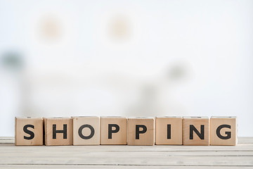 Image showing Shopping sign on a wooden table
