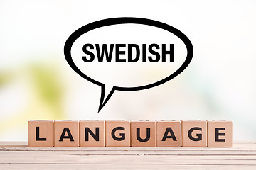 Image showing Swedish language lesson sign on a table