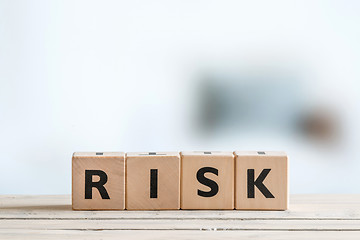 Image showing Risk message on a wooden table