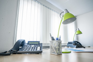 Image showing Office desk with a phone