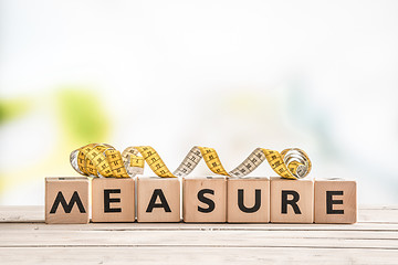 Image showing Measure word on a wooden table