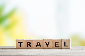 Image showing Travel sign on a wooden table