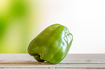 Image showing Green pepper on a wooden table