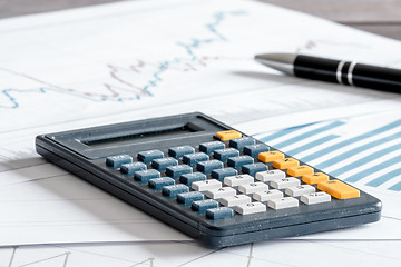 Image showing Calculator on some paper diagrams