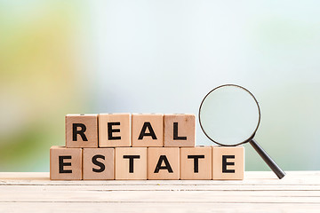 Image showing Real estate search sign on a table