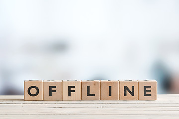 Image showing Offline sign on a wooden table