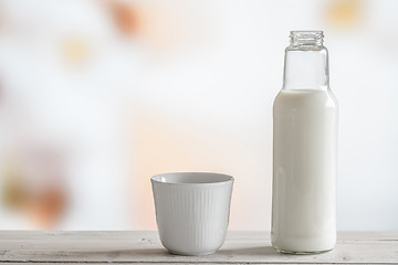 Image showing Milk bottle and a cup