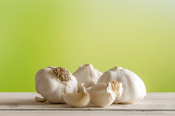 Image showing Garlic on a wooden table