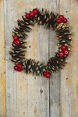 Image showing Christmas wreath of cones and berries