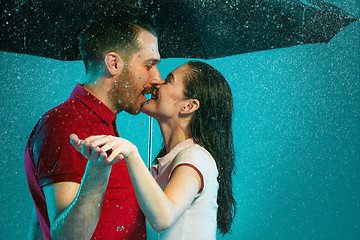 Image showing The loving couple in the rain