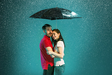 Image showing The loving couple in the rain