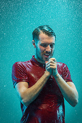 Image showing The portrait of young man in the rain