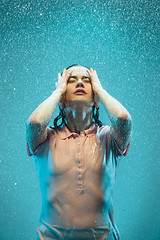 Image showing The portrait of young beautiful woman in the rain