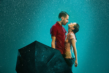 Image showing The loving couple in the rain