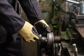 Image showing worker in protective gloves