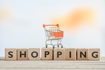 Image showing Shopping sign with a orange cart