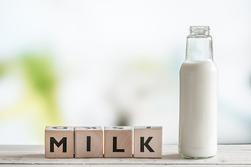 Image showing The word milk and a bottle