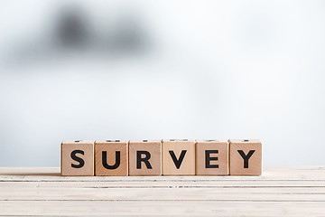 Image showing Survey sign on a wooden table