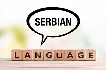 Image showing Serbian language lesson sign on a table