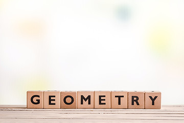 Image showing Geometry lessons sign on a table