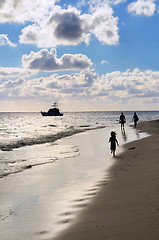 Image showing Family walking on a beach