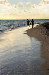 Image showing Couple walking on a beach