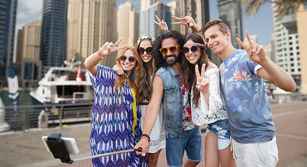 Image showing hippie friends with smartphone on selfie stick