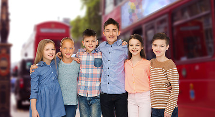 Image showing happy smiling children hugging over london city