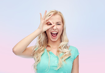 Image showing young woman making ok hand gesture