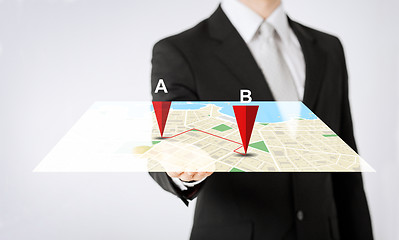 Image showing close up of man hand showing gps navigator map