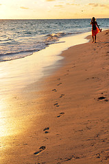 Image showing Woman walking on beach