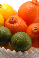 Image showing three citrus in white bowl