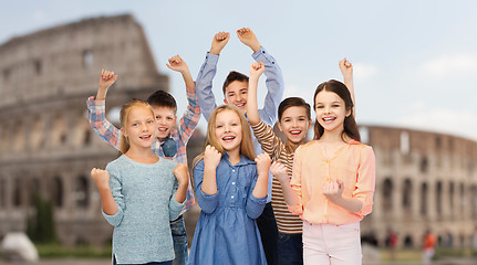 Image showing happy children celebrating victory over coliseum