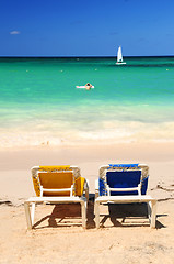 Image showing Chairs on sandy tropical beach