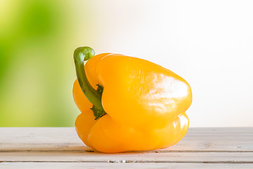 Image showing Yellow pepper on a wooden table