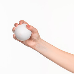 Image showing The female hand holding white blank styrofoam oval 