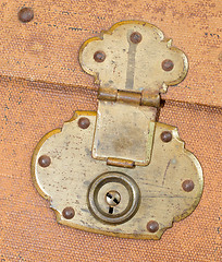 Image showing Old canvas trunk lock close up