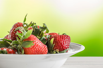 Image showing Red strawberries on a white plate