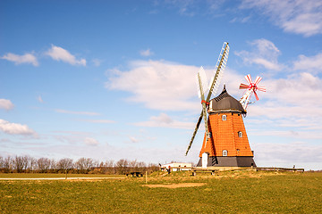 Image showing Mill on a green meadow in the spring