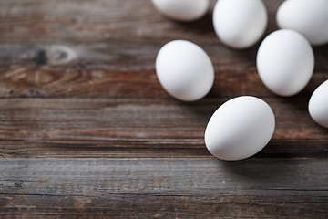 Image showing White eggs on the old wood table