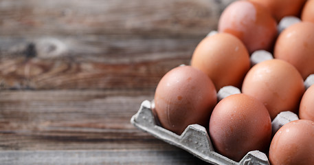 Image showing Brown eggs on a rustic wooden table