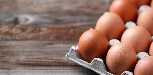 Image showing Brown eggs on a rustic wooden table