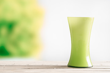 Image showing Green vase on a wooden table
