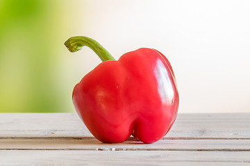 Image showing Red pepper on a wooden table
