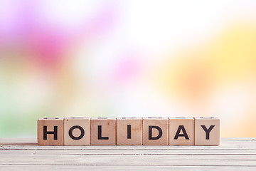 Image showing Holiday sign on a wooden table
