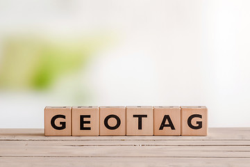 Image showing Geotag sign on a table