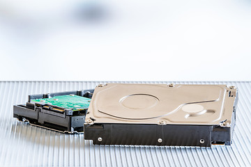 Image showing Harddisks on a metal surface