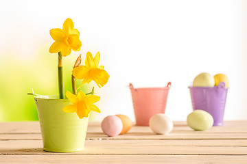 Image showing Daffodils in the easter on a wooden table