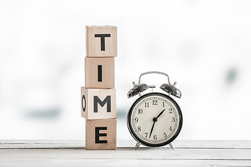 Image showing Time concept with a clock and a word